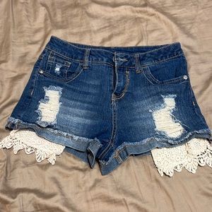 Lace pocket semi distressed shorts